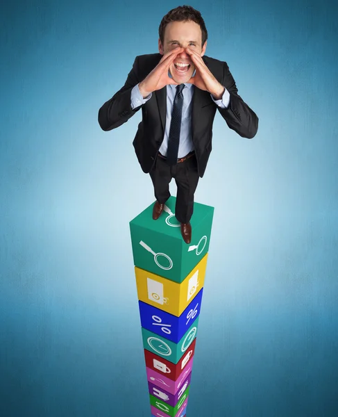 Shouting businessman on cubes — Stock Photo, Image