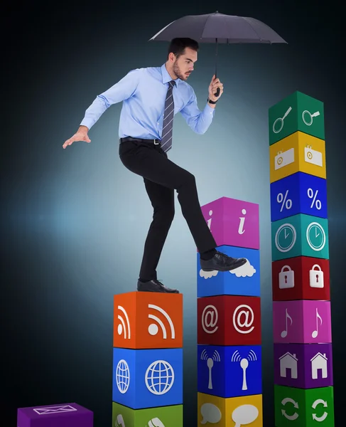 Businessman holding umbrella — Stock Photo, Image