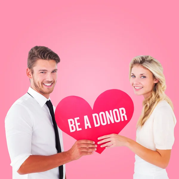 Couple holding red heart — Stock Photo, Image