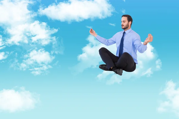 Hombre de negocios meditando en pose de loto —  Fotos de Stock