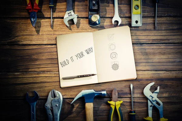 Palabra construir a su manera y cuaderno — Foto de Stock