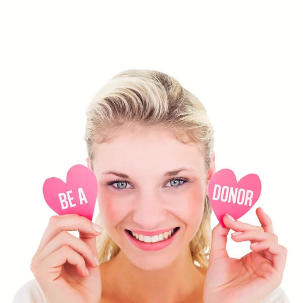 Woman holding little hearts — Stock Photo, Image