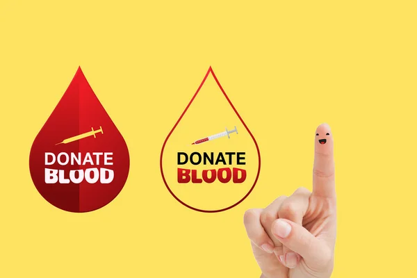 Blood donation against yellow vignette — Stock Photo, Image