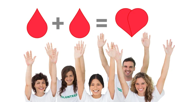 Volunteers raising arms — Stock Photo, Image