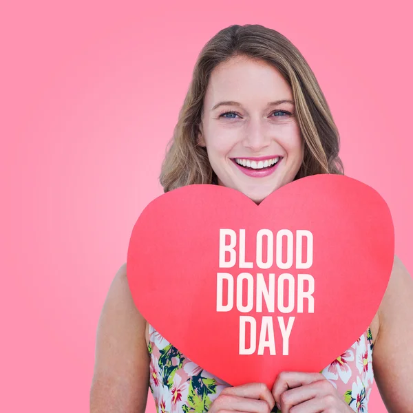 Woman holding heart card — Stock Photo, Image