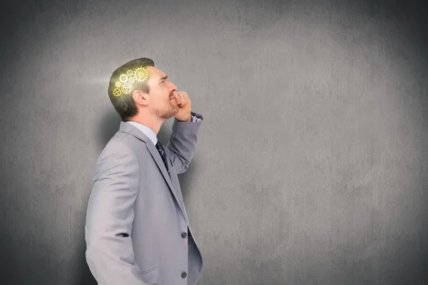 Pensando hombre de negocios contra blanco y gris — Foto de Stock