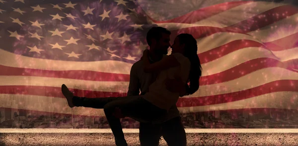 Couple having fun against fireworks — Stock Photo, Image