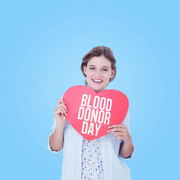 Woman holding heart card — Stock Photo, Image