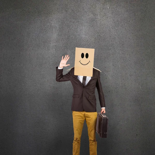Anonymous businessman standing with box on head — Stock Photo, Image