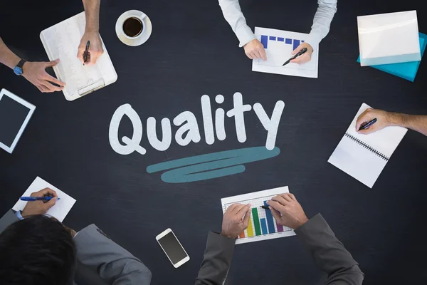 Quality against blackboard — Stock Photo, Image