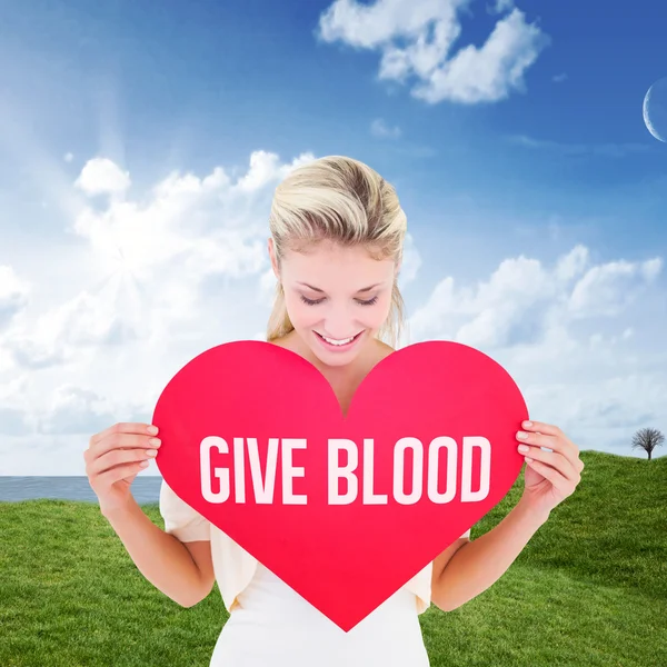 Woman showing red heart — Stock Photo, Image