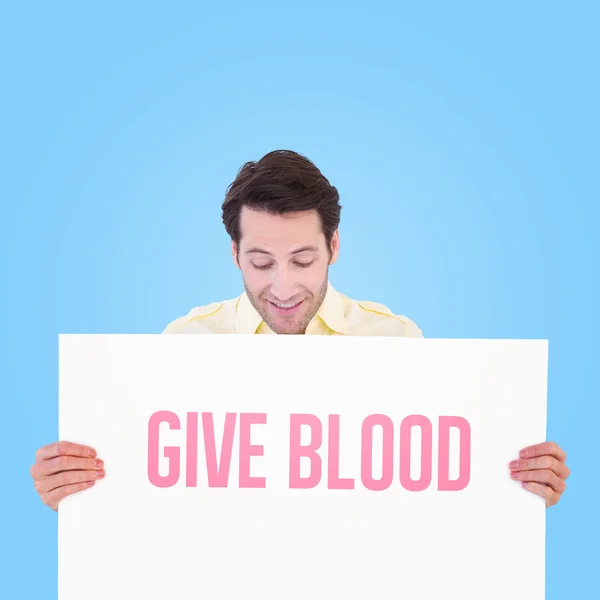 Man holding poster — Stock Photo, Image