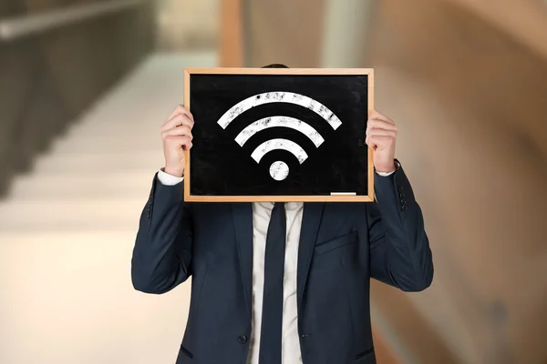 Businessman holding board — Stock Photo, Image