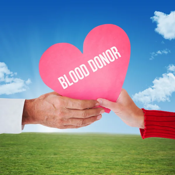 Hands holding blood donate card — Stock Photo, Image