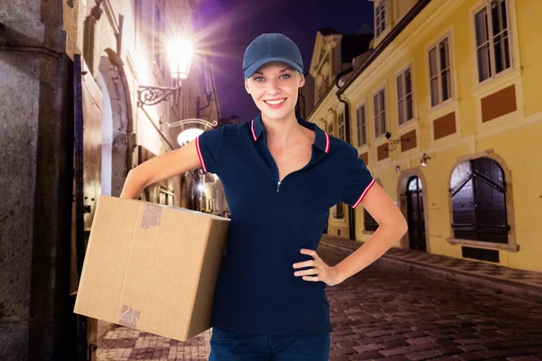 Delivery woman holding cardboard box — Stock Photo, Image