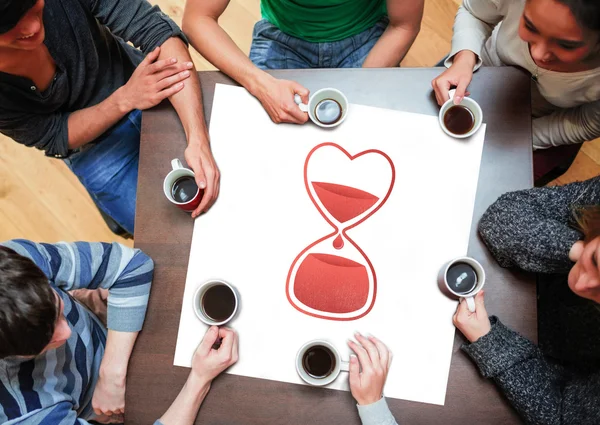 People sitting around table drinking coffee — Stok fotoğraf