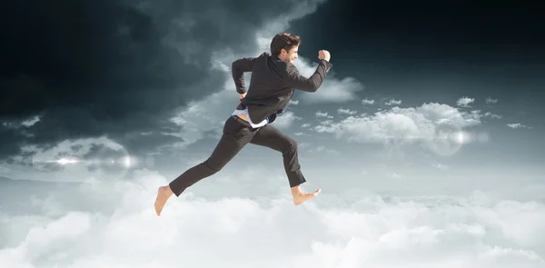 Hombre de negocios descalzo saltando — Foto de Stock