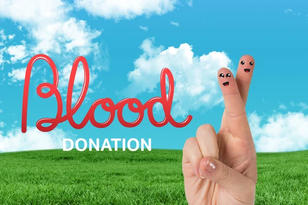 Blood donation against green field — Stock Photo, Image