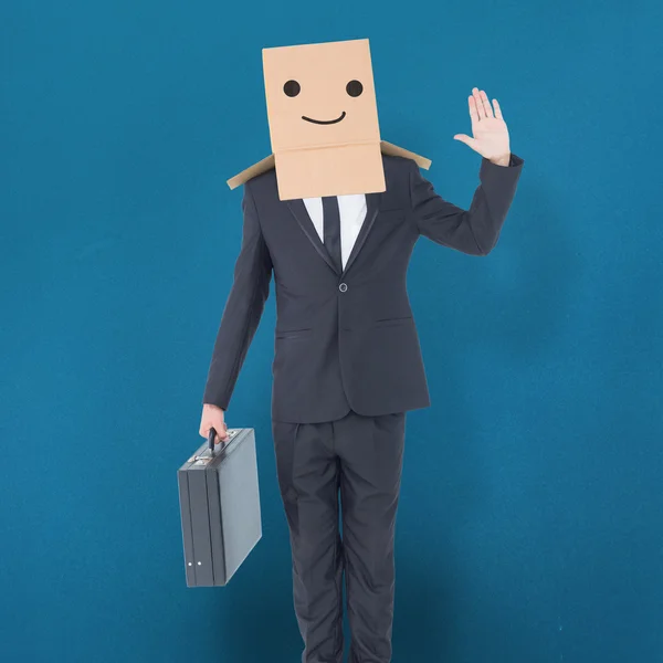 Businessman standing with box on head — Stock Photo, Image