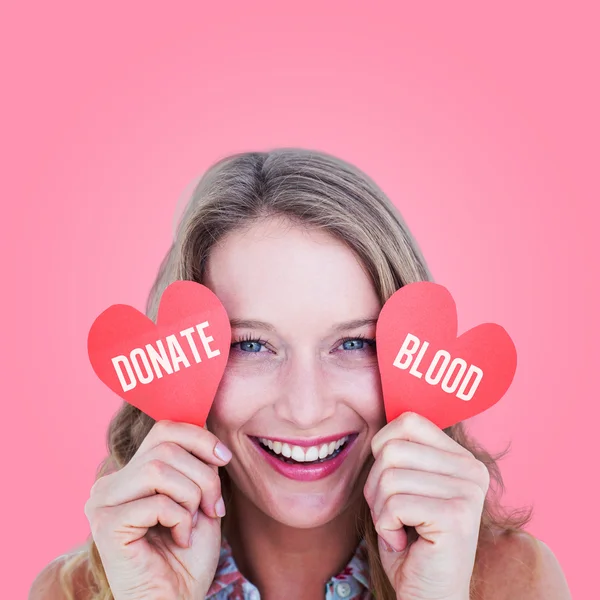 Woman holding heart cards — Stock Photo, Image