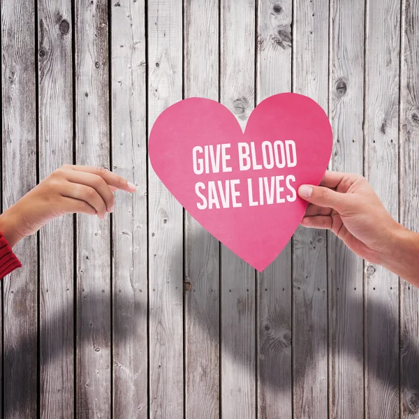 Hands holding pink heart — Stock Photo, Image