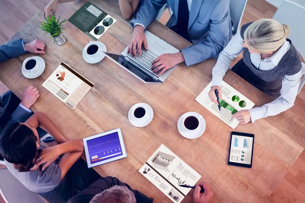 Business team discussing graphs — Stock Photo, Image