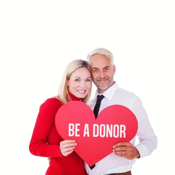 Couple holding red heart — Stock Photo, Image