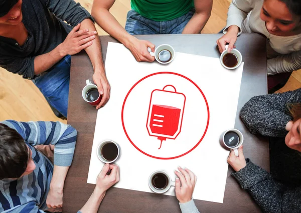 People sitting around table drinking coffee — Stock Photo, Image