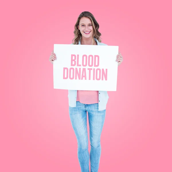 Woman holding donate blood poster — Stock Photo, Image