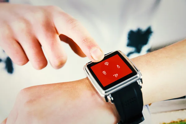 Composite image of woman using smartwatch — Stock Photo, Image