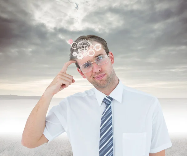 Businessman thinking with finger on temple — Stock Photo, Image