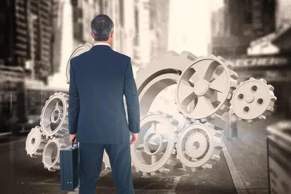 Businessman in suit holding a briefcase — Stock Photo, Image