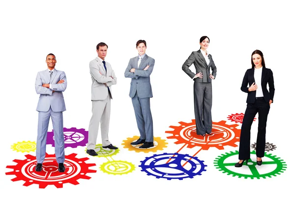 Business team against cogs and wheels — Stock Photo, Image