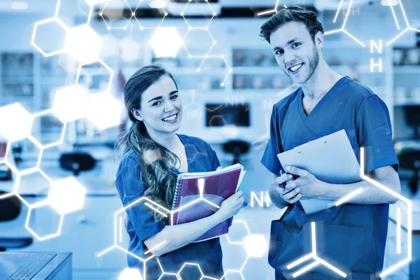 Medical students smiling at camera — Stock Photo, Image