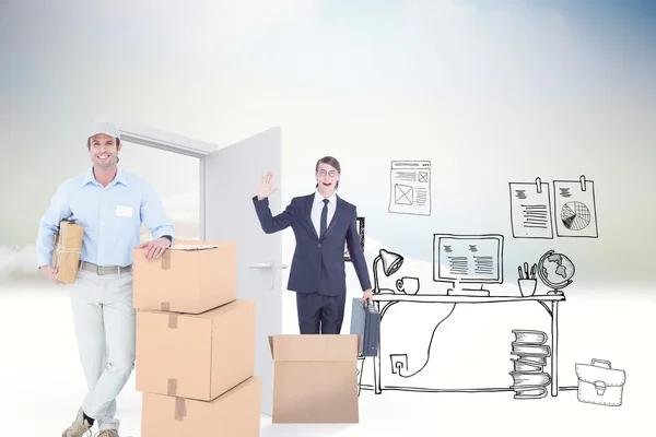 delivery man leaning on cardboard boxes