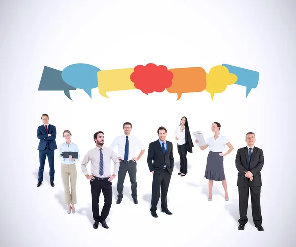 Business team against speech bubbles — Stock Photo, Image