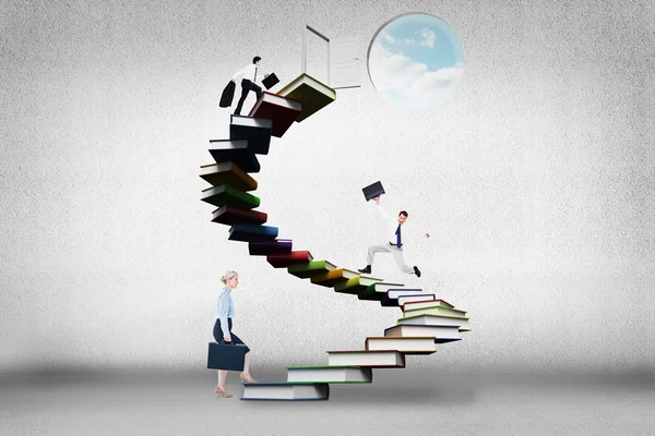 Businesspeople on book stairs — Stock Photo, Image