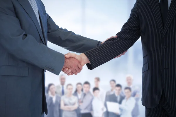 Composite image of handshake in agreement — Stock Photo, Image