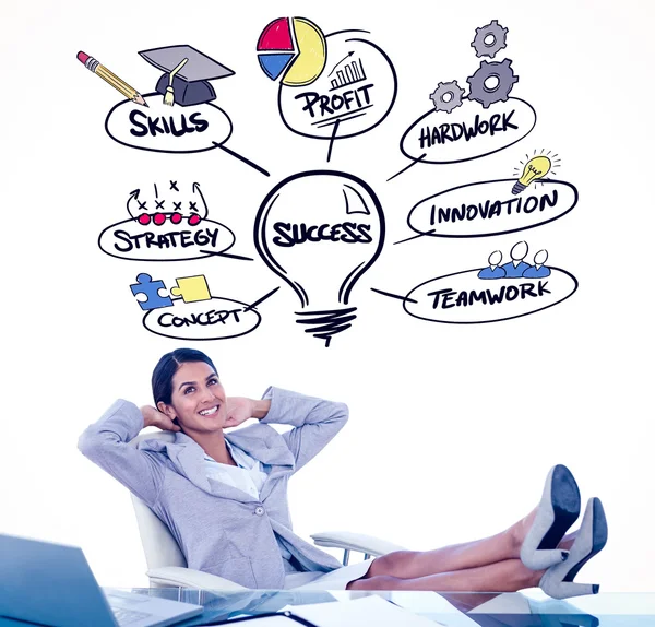 Businesswoman relaxing in a swivel chair — Stock Photo, Image