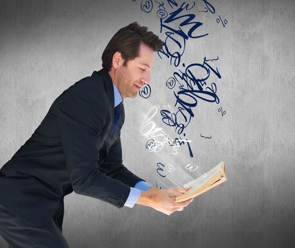 Businessman reading a book — Stock Photo, Image