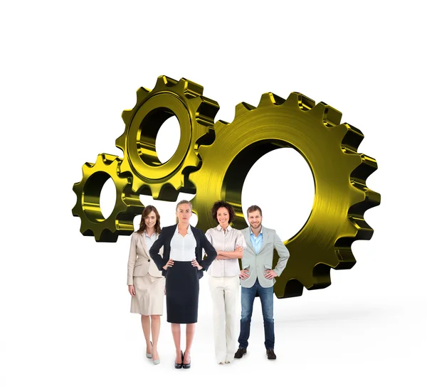 Business team against metal cog and wheel — Stock Photo, Image