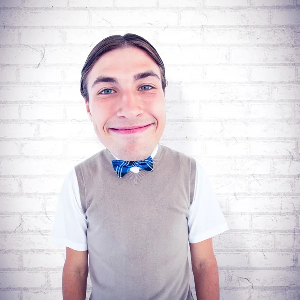 Nerd smiling against wall — Stock Photo, Image