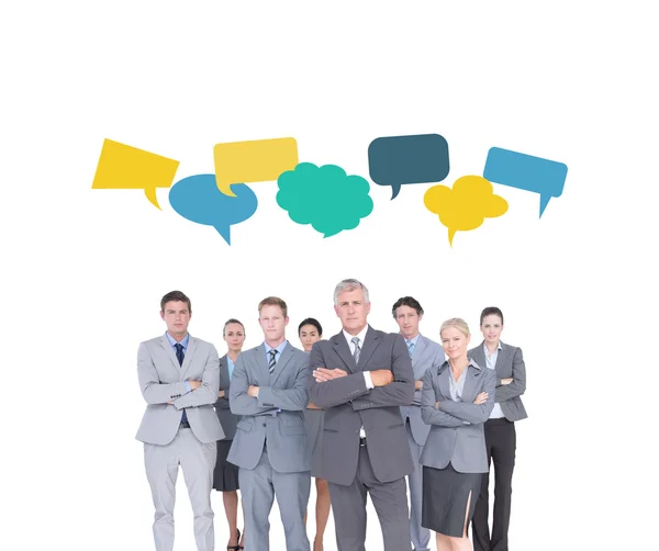 Business team against speech bubbles — Stock Photo, Image