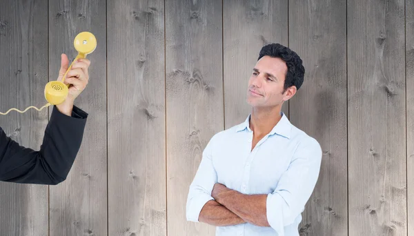 Handsome man standing with arms crossed — Stock Photo, Image