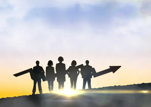 Business team with arrow against sunset sky — Stock Photo, Image