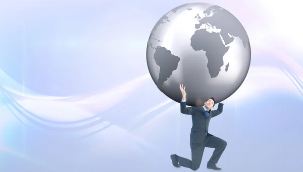 Businessman carrying the world — Stock Photo, Image