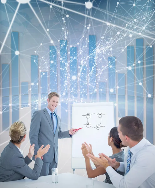 Manager presenting whiteboard to his colleagues — Stock Photo, Image