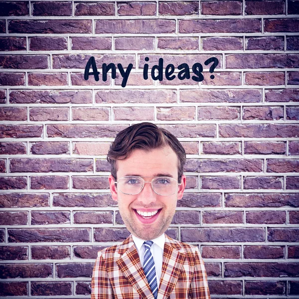 Geeky uomo d'affari contro muro di mattoni — Foto Stock