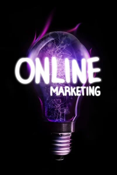 Online marketing against glowing light bulb — Stock Photo, Image