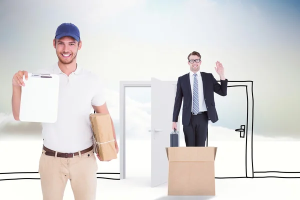 Delivery man holding cardboard box — Stock Photo, Image